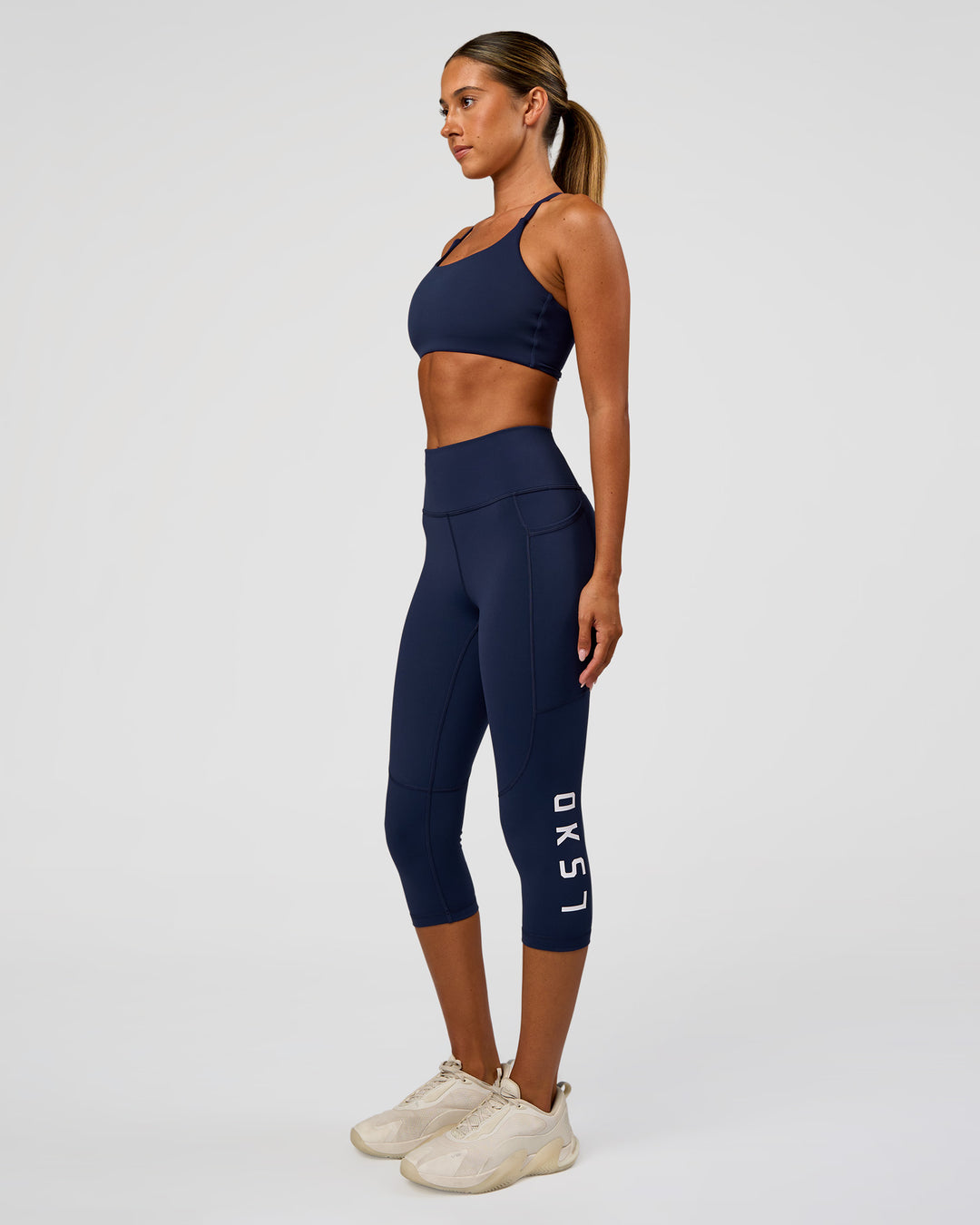 Woman wearing Twist Sports Bra - Future Navy | Model:Charli | Size:XS - view 5