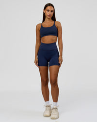 Woman wearing Twist Sports Bra - Future Navy | Model:Brylee | Size:XS | Thumbnail Index: 6