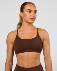 Woman wearing Twist Sports Bra - Hot Chocolate | Model:Maja | Size:XS | Thumbnail Index: 0