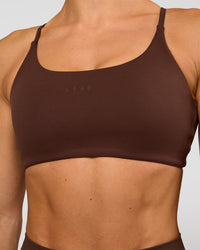 Woman wearing Twist Sports Bra - Hot Chocolate | Model:Maja | Size:XS | Thumbnail Index: 2