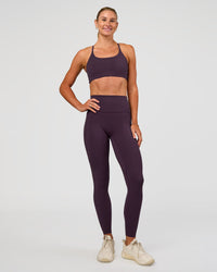 Woman wearing Twist Sports Bra - Midnight Plum | Model:Emelia | Size:XS | Thumbnail Index: 8