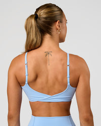Woman wearing Twist Sports Bra - Open Air | Model:Maja | Size:XS | Thumbnail Index: 0