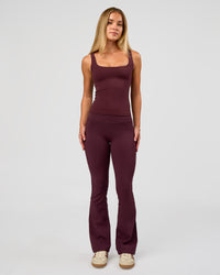 Woman wearing Twist Square Neck Shelf Bra Tank in Cherry Lacquer | Model:Issy | Size:XS | Thumbnail Index: 4