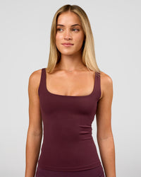 Woman wearing Twist Square Neck Shelf Bra Tank in Cherry Lacquer | Model:Issy | Size:XS | Thumbnail Index: 2