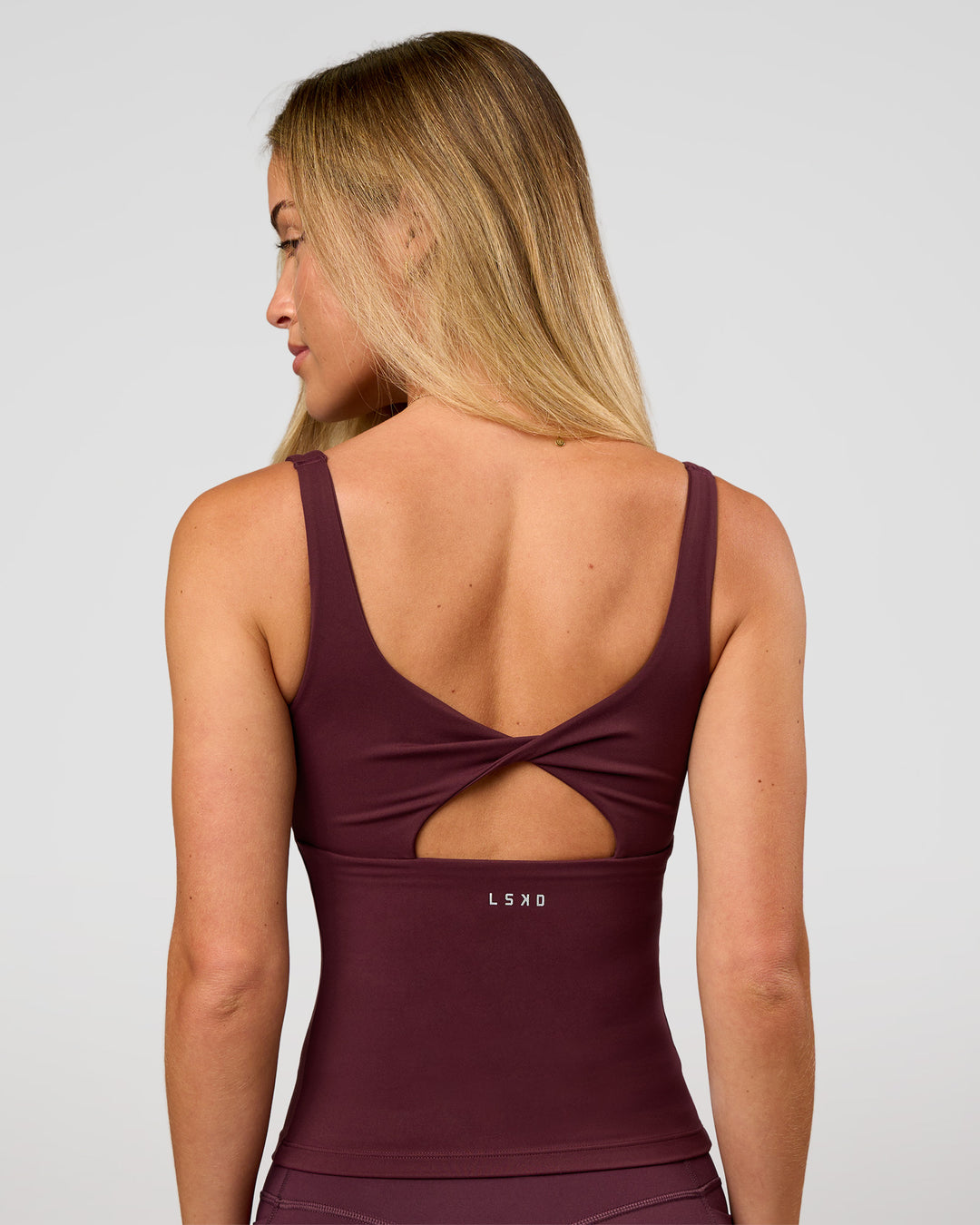 Woman wearing Twist Square Neck Shelf Bra Tank in Cherry Lacquer | Model:Issy | Size:XS - view 4