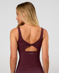 Woman wearing Twist Square Neck Shelf Bra Tank in Cherry Lacquer | Model:Issy | Size:XS | Thumbnail Index: 3