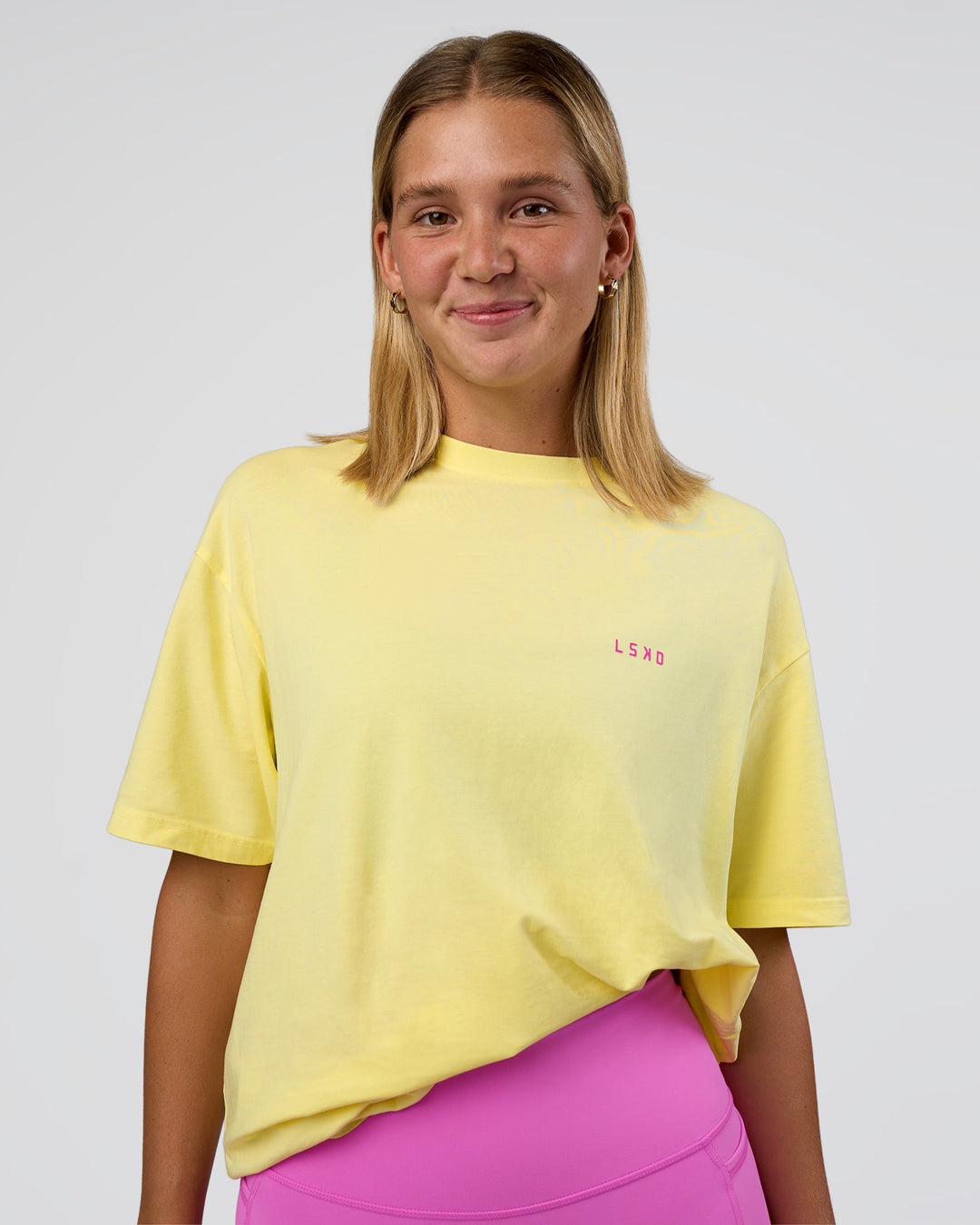 Woman wearing Unfit Club FLXCotton Oversized Tee - Yellow Fizz Washed-Ultra Fuchsia | Model:Amity | Size:XS - view 6