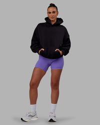 Woman wearing Unisex Keep on Running Hoodie Oversize - Black-White | Thumbnail Index: 10