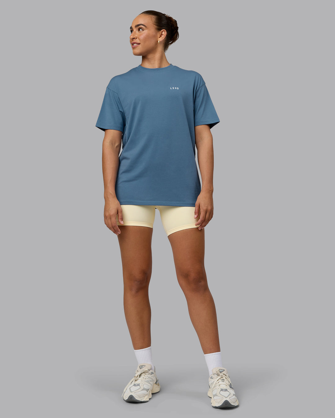 Woman wearing Unisex Move Fast Value Series FLXCotton Tee Oversize - Elemental Blue-Off White - view 11