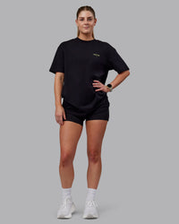 Woman wearing Unisex RUN CLUB FLXCotton Tee Oversize - Black-Vol | Thumbnail Index: 12