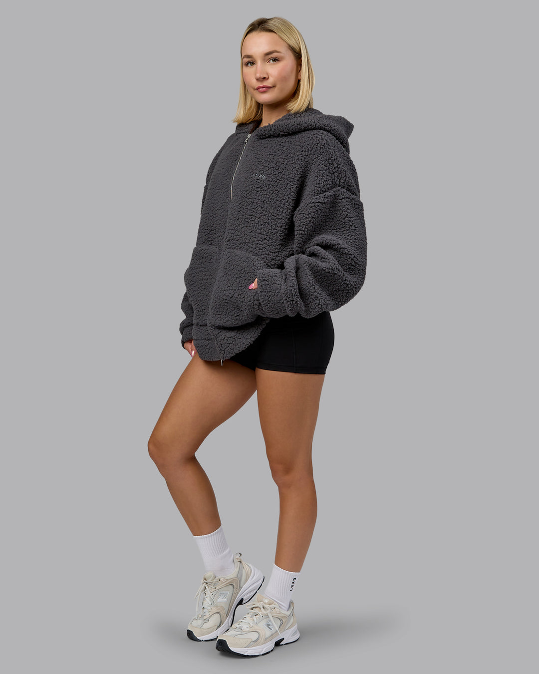 Woman wearing Sherpa Oversized Jacket - Dark Storm | Model:Halle | Size:XS - view 14