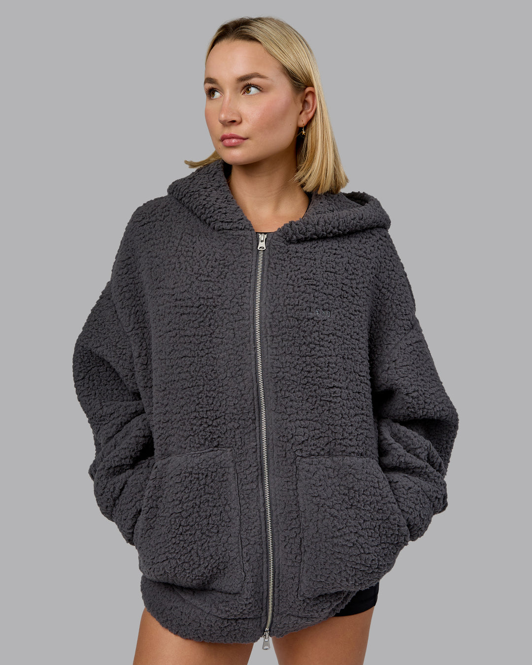 Woman wearing Sherpa Oversized Jacket - Dark Storm | Model:Halle | Size:XS - view 2