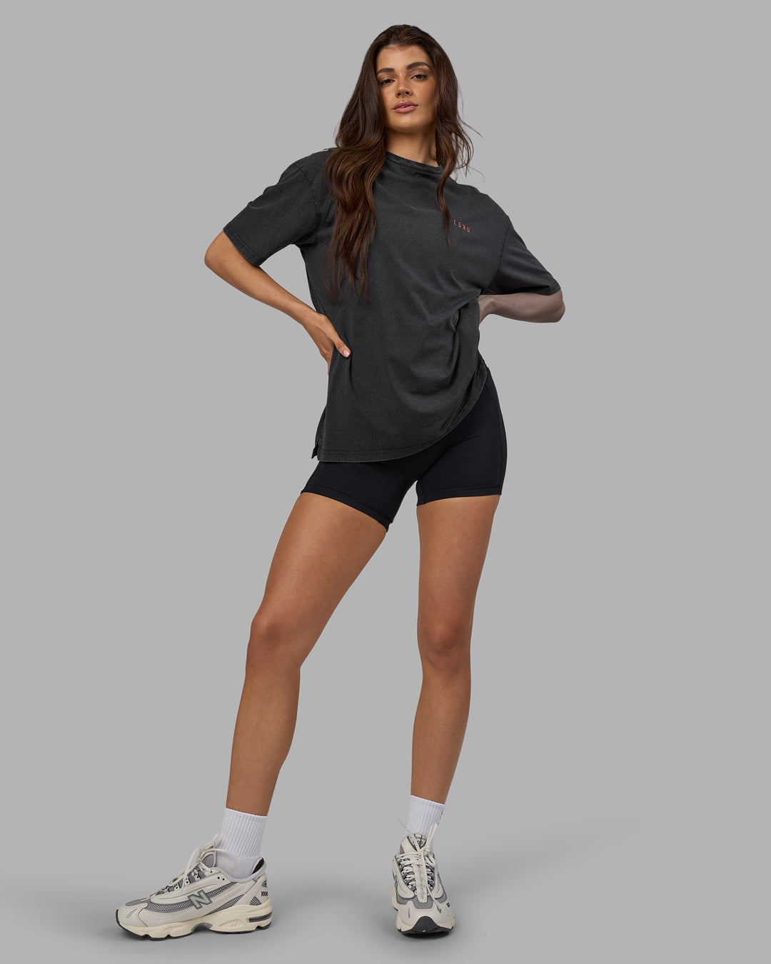Woman wearing Unisex Strike Through FLXCotton Tee Oversize - Black Washed-Cantaloupe | Model:Phoebe | Size:XS - view 8