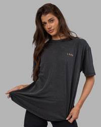 Woman wearing Unisex Strike Through FLXCotton Tee Oversize - Black Washed-Cantaloupe | Model:Phoebe | Size:XS | Thumbnail Index: 3