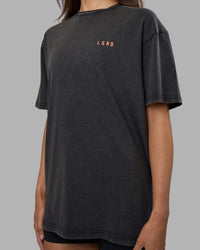 Woman wearing Unisex Strike Through FLXCotton Tee Oversize - Black Washed-Cantaloupe | Model:Phoebe | Size:XS | Thumbnail Index: 8