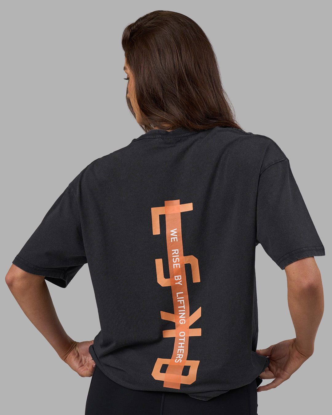 Woman wearing Unisex Strike Through FLXCotton Tee Oversize - Black Washed-Cantaloupe | Model:Phoebe | Size:XS - view 5