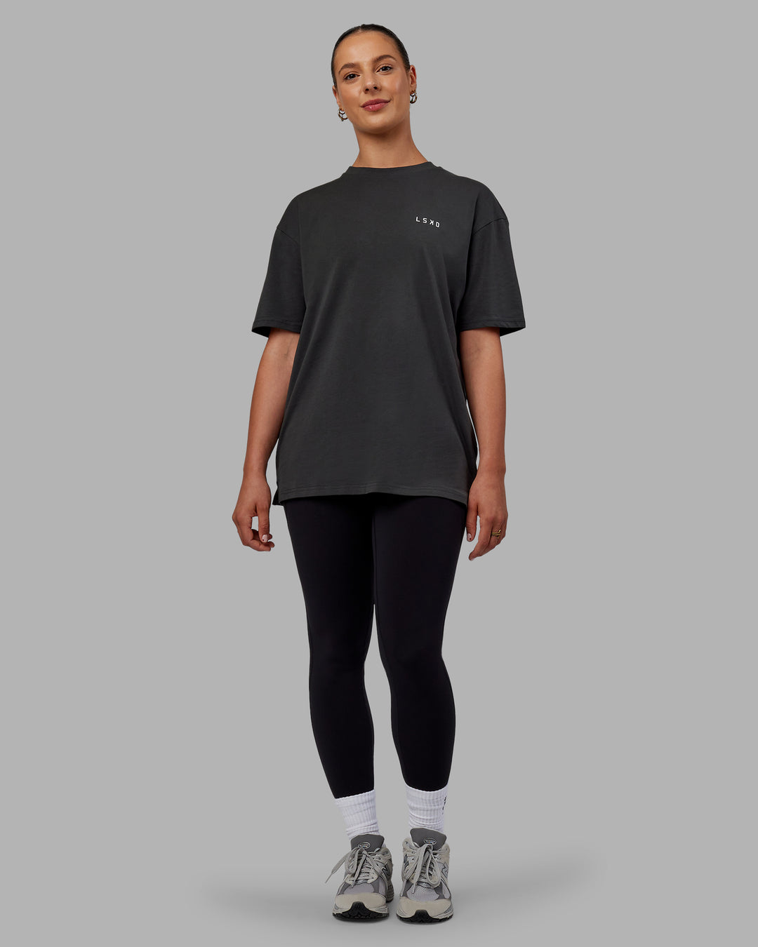 Woman wearing Unisex Strike Through FLXCotton Tee Oversize - Pirate Black-Black - view 11