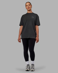 Woman wearing Unisex Strike Through FLXCotton Tee Oversize - Pirate Black-Black | Thumbnail Index: 10