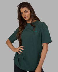 Woman wearing Unisex Strike Through FLXCotton Tee Oversize - Vital Green-Alexandrite | Model:Phoebe | Size:XS | Thumbnail Index: 2