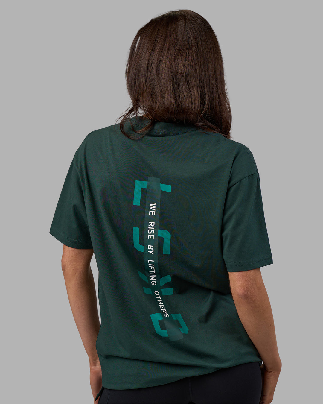 Woman wearing Unisex Strike Through FLXCotton Tee Oversize - Vital Green-Alexandrite | Model:Phoebe | Size:XS - view 2