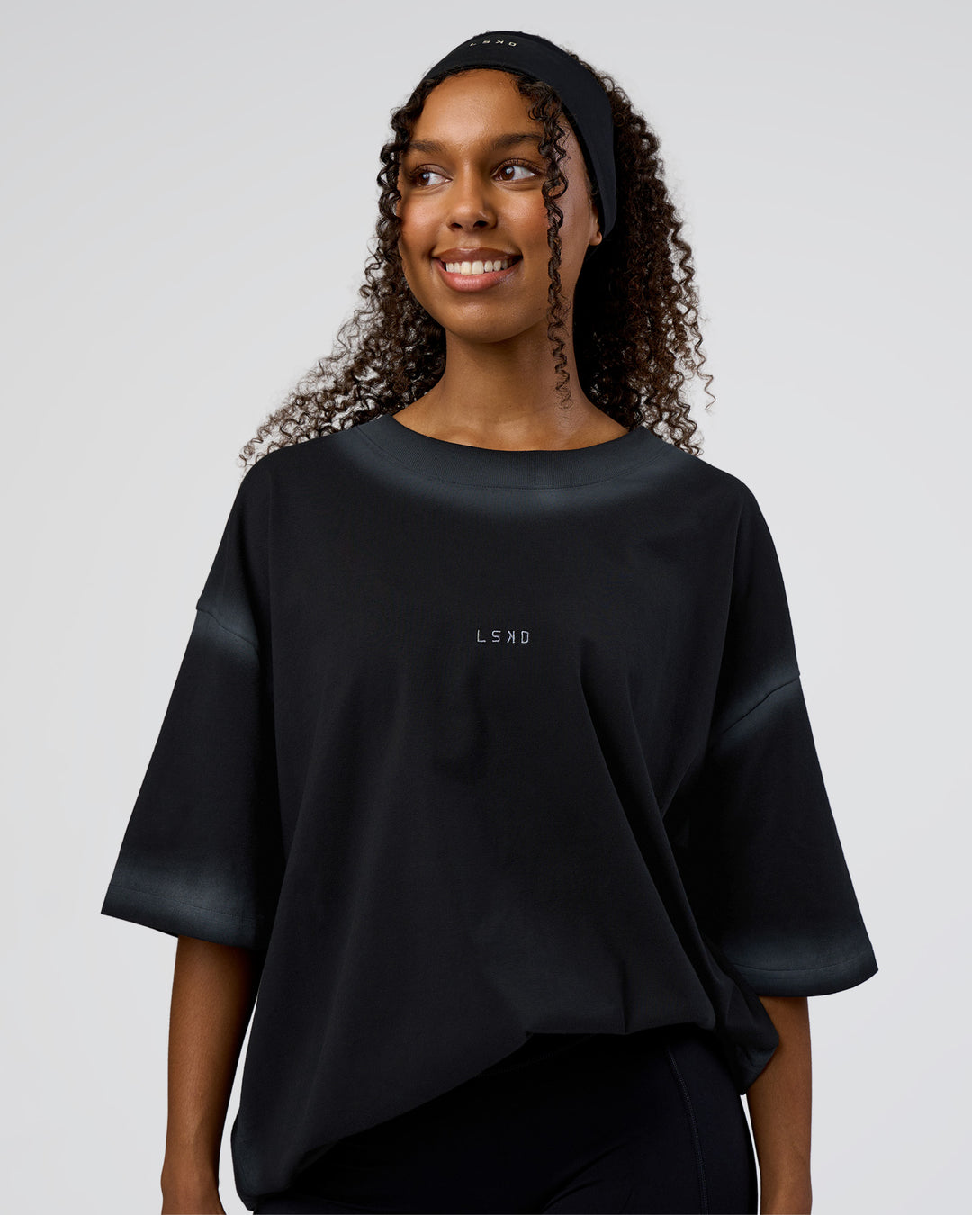 Woman wearing Urban Blur Heavyweight Unisex Oversized Tee - Black-Dark Storm | Model:Jordan | Size:S - view 3