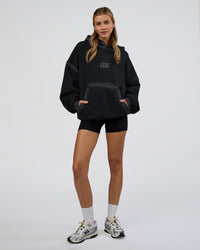 Woman wearing Urban Blur Unisex Oversized Hoodie - Black-Dark Storm | Model:Leilani | Size:XS | Thumbnail Index: 7