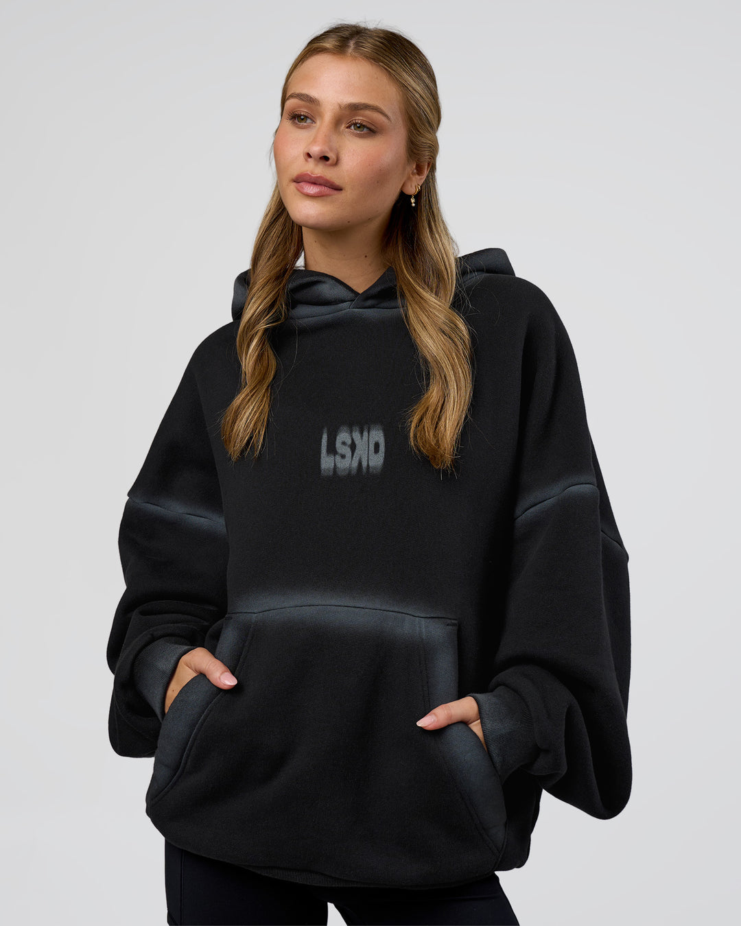 Woman wearing Urban Blur Unisex Oversized Hoodie - Black-Dark Storm | Model:Leilani | Size:XS - view 4