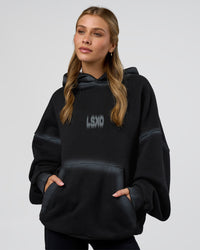 Woman wearing Urban Blur Unisex Oversized Hoodie - Black-Dark Storm | Model:Leilani | Size:XS | Thumbnail Index: 3