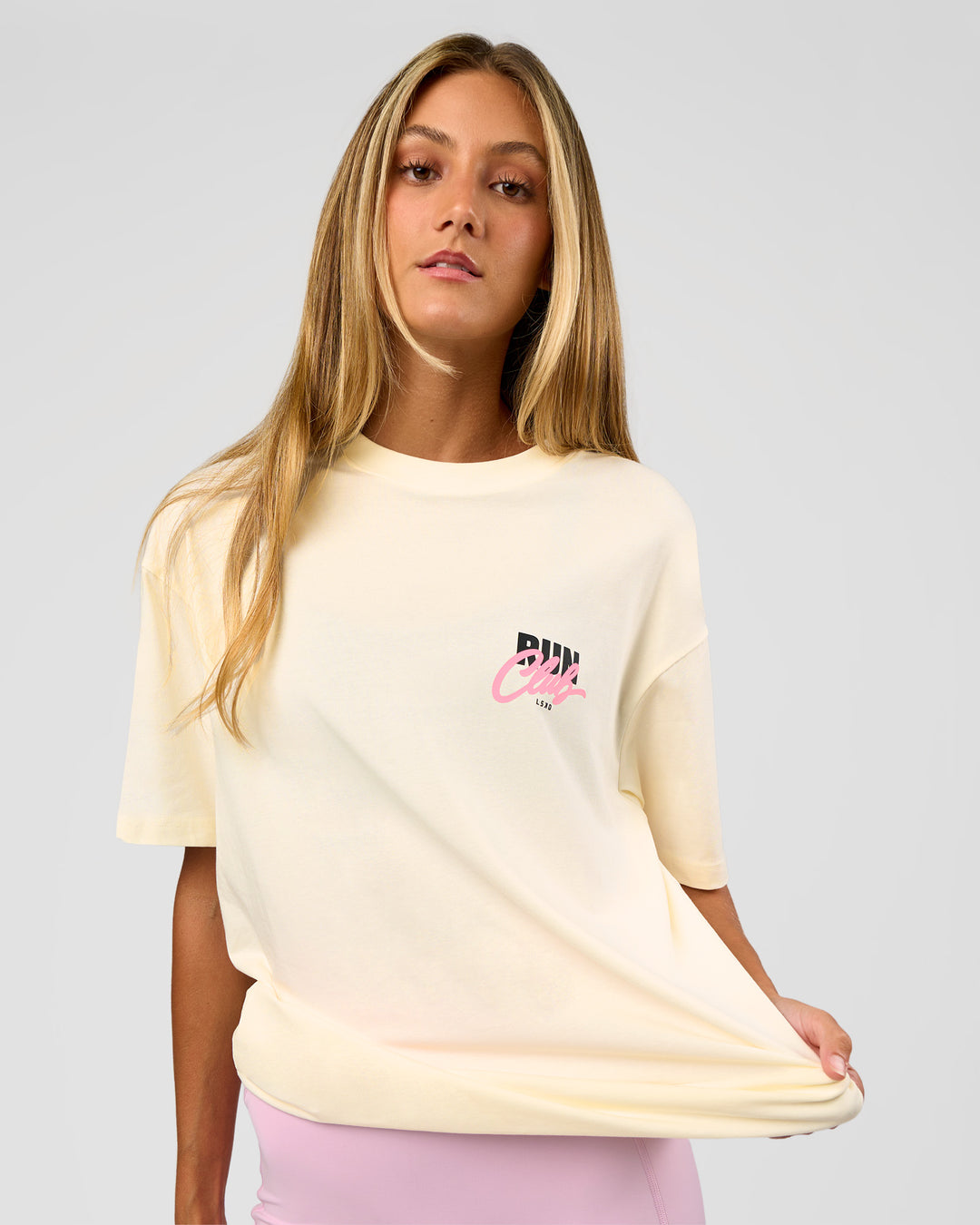 Woman wearing Values Run Club FLXCotton Tee - Off White-Candy Pink | Model:Georgia | Size:XS - view 5
