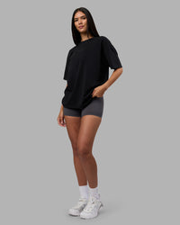 Woman wearing Variation Heavyweight FLXCotton Oversized Tee - Black-Black | Model:Rhiley | Size:XS | Thumbnail Index: 3