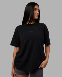 Woman wearing Variation Heavyweight FLXCotton Oversized Tee - Black-Black | Model:Rhiley | Size:XS | Thumbnail Index: 6