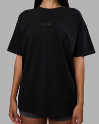 Woman wearing Variation Heavyweight FLXCotton Oversized Tee - Black-Black | Model:Rhiley | Size:XS | Thumbnail Index: 9