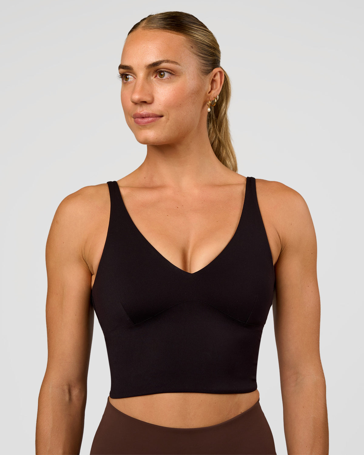 Woman wearing Vitality Long Line Sports Bra - Black | Model:Maja | Size:XS