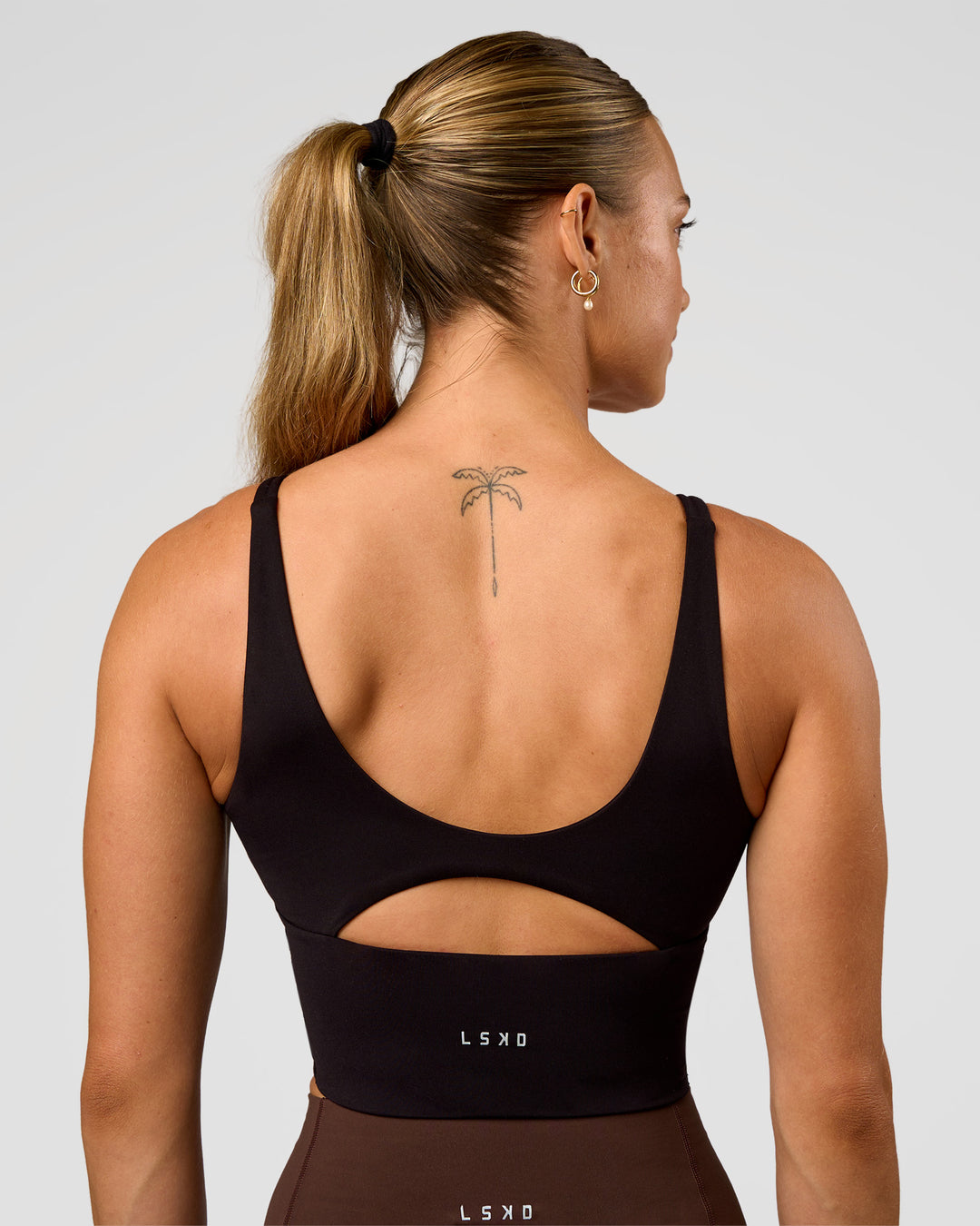 Woman wearing Vitality Long Line Sports Bra - Black | Model:Maja | Size:XS - view 2