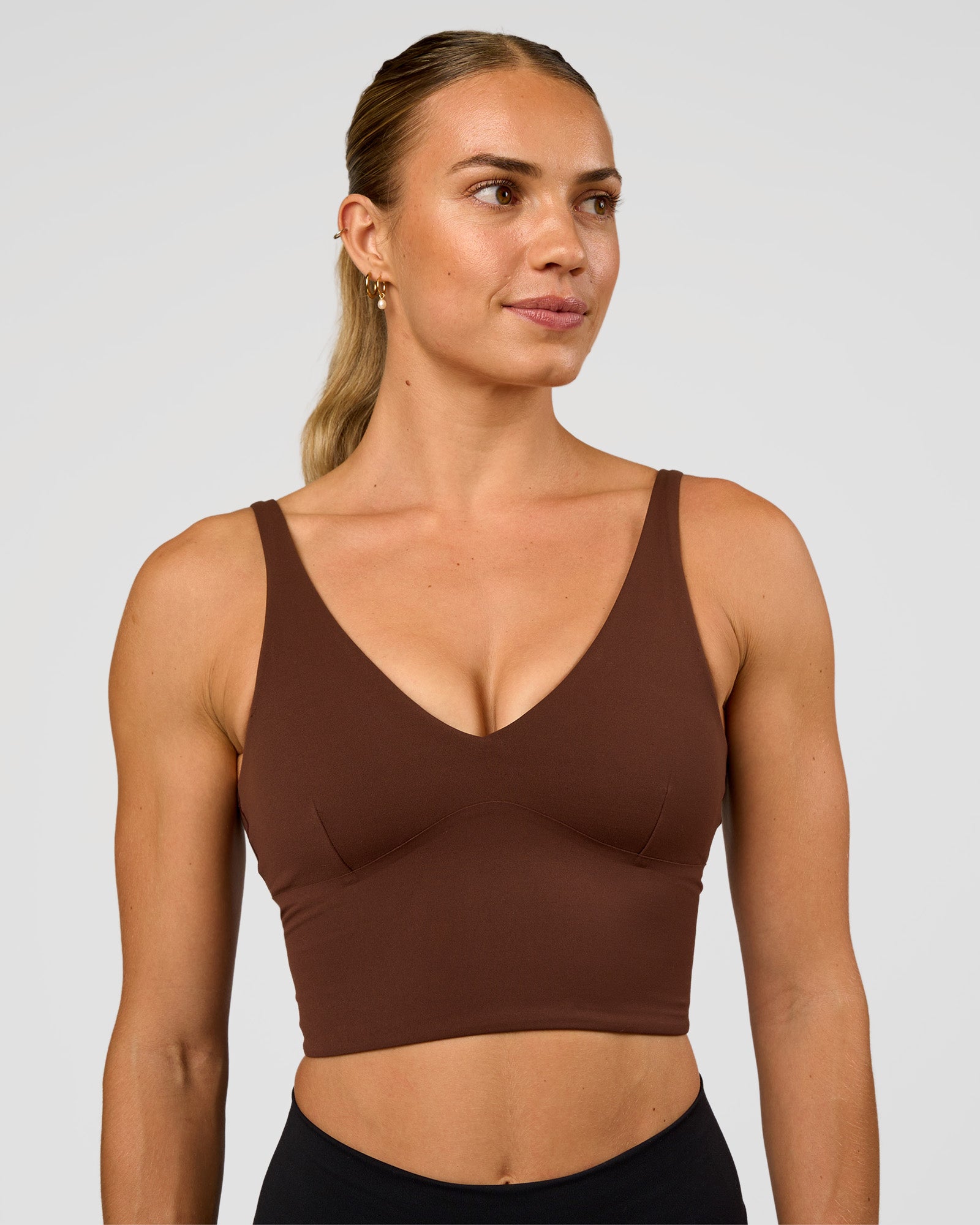 Woman wearing Vitality Long Line Sports Bra - Hot Chocolate | Model:Maja | Size:XS