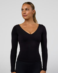 Woman wearing Vitality Long Sleeve Top - Black | Model:Maja | Size:XS | Thumbnail Index: 1