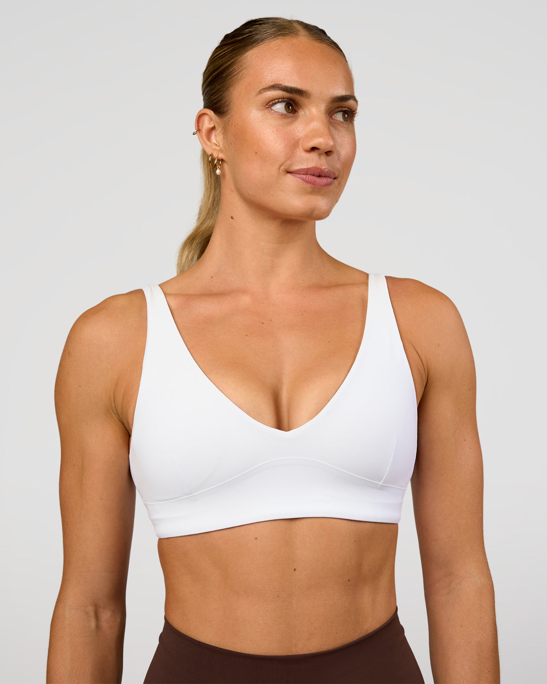 Woman wearing Vitality Sports Bra - White | Model:Maja | Size:XS - view 2