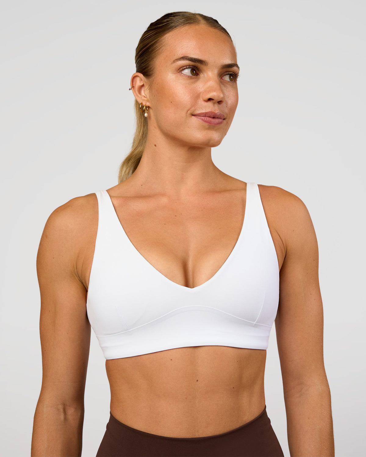 Woman wearing Vitality Sports Bra - White | Model:Maja | Size:XS