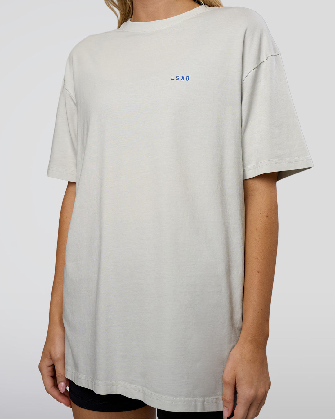 Woman wearing We Love This  FLXCotton Oversized Tee - Digital Mist Washed-Electric Indigo | Model:Leilani | Size:XS - view 8