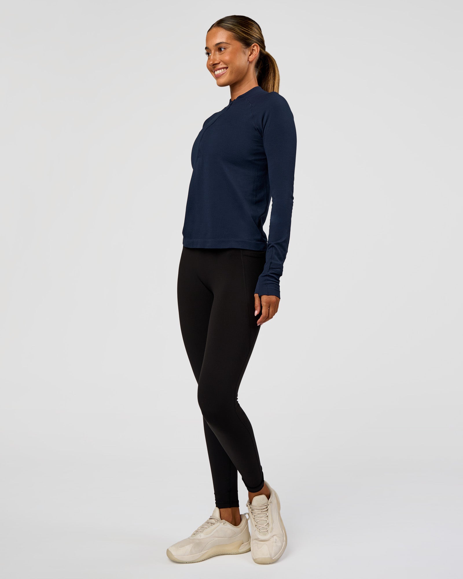 Woman wearing AeroFLX+ Long Sleeve Half Zip - Future Navy/Future Navy | Model:Charli | Size:XS