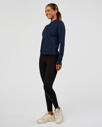 Woman wearing AeroFLX+ Long Sleeve Half Zip - Future Navy/Future Navy | Model:Charli | Size:XS | Thumbnail Index: 1