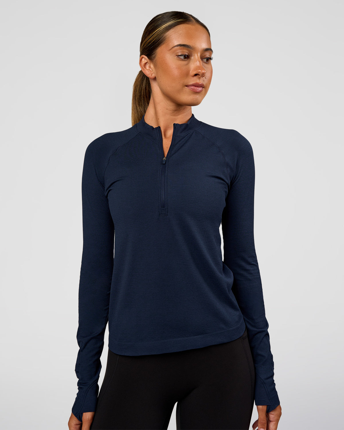 Woman wearing AeroFLX+ Long Sleeve Half Zip - Future Navy/Future Navy | Model:Charli | Size:XS