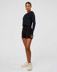 Woman wearing AeroFLX+ Seamless Long Sleeve Skimmer Tee - Black Marl | Model:Charli | Size:XS | Thumbnail Index: 5