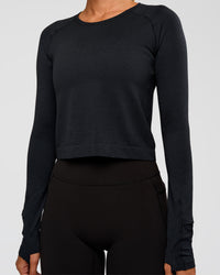 Woman wearing AeroFLX+ Seamless Long Sleeve Skimmer Tee - Black Marl | Model:Charli | Size:XS | Thumbnail Index: 4