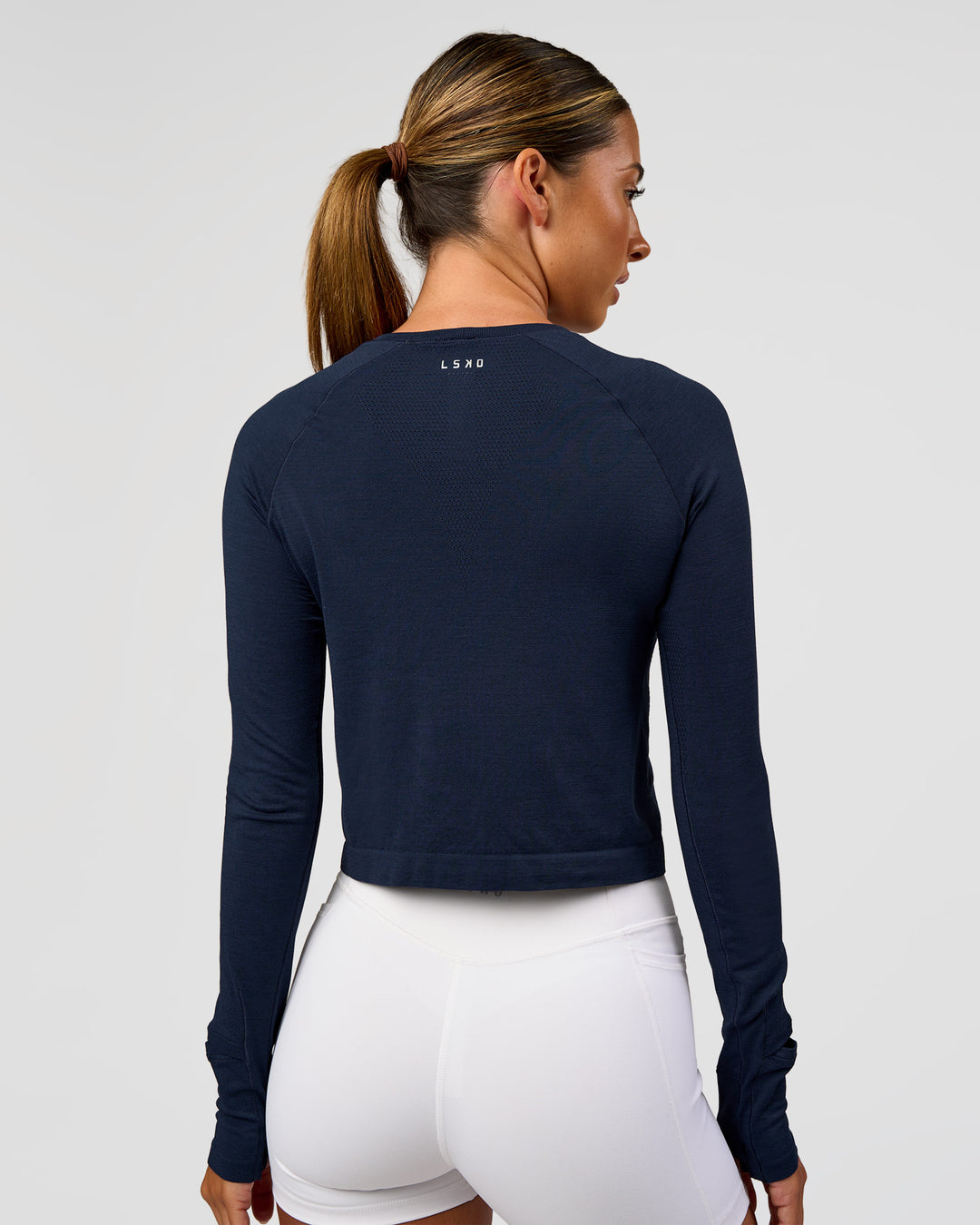 Woman wearing AeroFLX+ Seamless Long Sleeve Skimmer Tee - Future Navy/Future Navy | Model:Charli | Size:XS - view 5