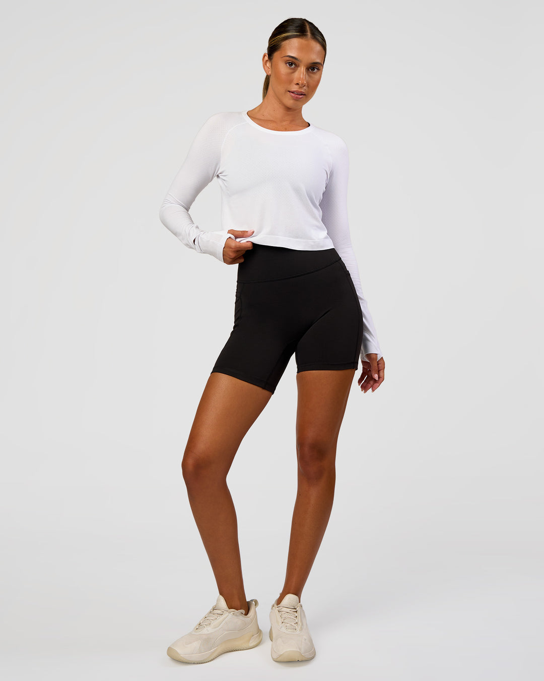 Woman wearing AeroFLX+ Seamless Long Sleeve Skimmer Tee - White/White | Model:Charli | Size:XS - view 6