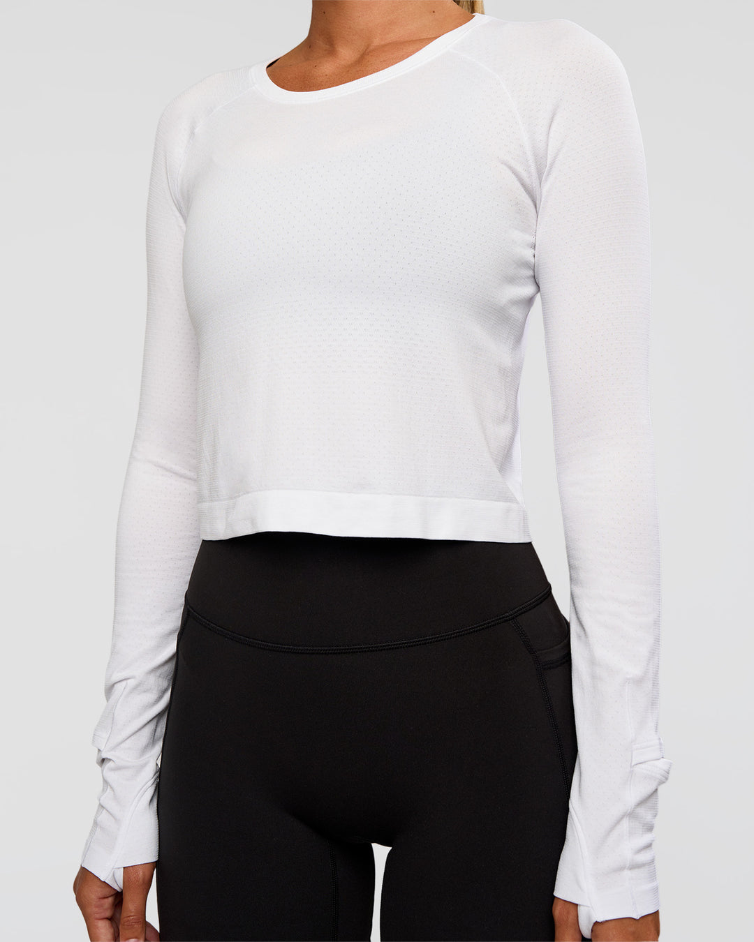 Woman wearing AeroFLX+ Seamless Long Sleeve Skimmer Tee - White/White | Model:Charli | Size:XS - view 9