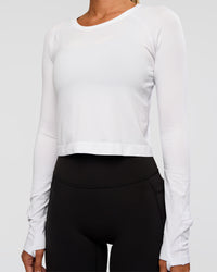 Woman wearing AeroFLX+ Seamless Long Sleeve Skimmer Tee - White/White | Model:Charli | Size:XS | Thumbnail Index: 8