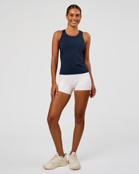Woman wearing AeroFLX+ Seamless Tank - Future Navy/Future Navy | Model:Charli | Size:XS | Thumbnail Index: 1