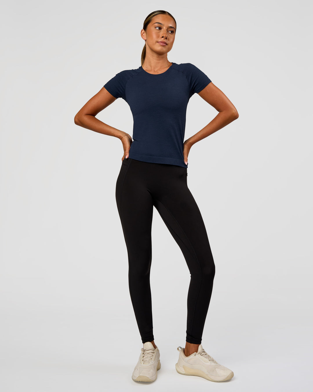 Woman wearing AeroFLX+ Seamless Tee - Future Navy/Future Navy | Model:Charli | Size:XS - view 7